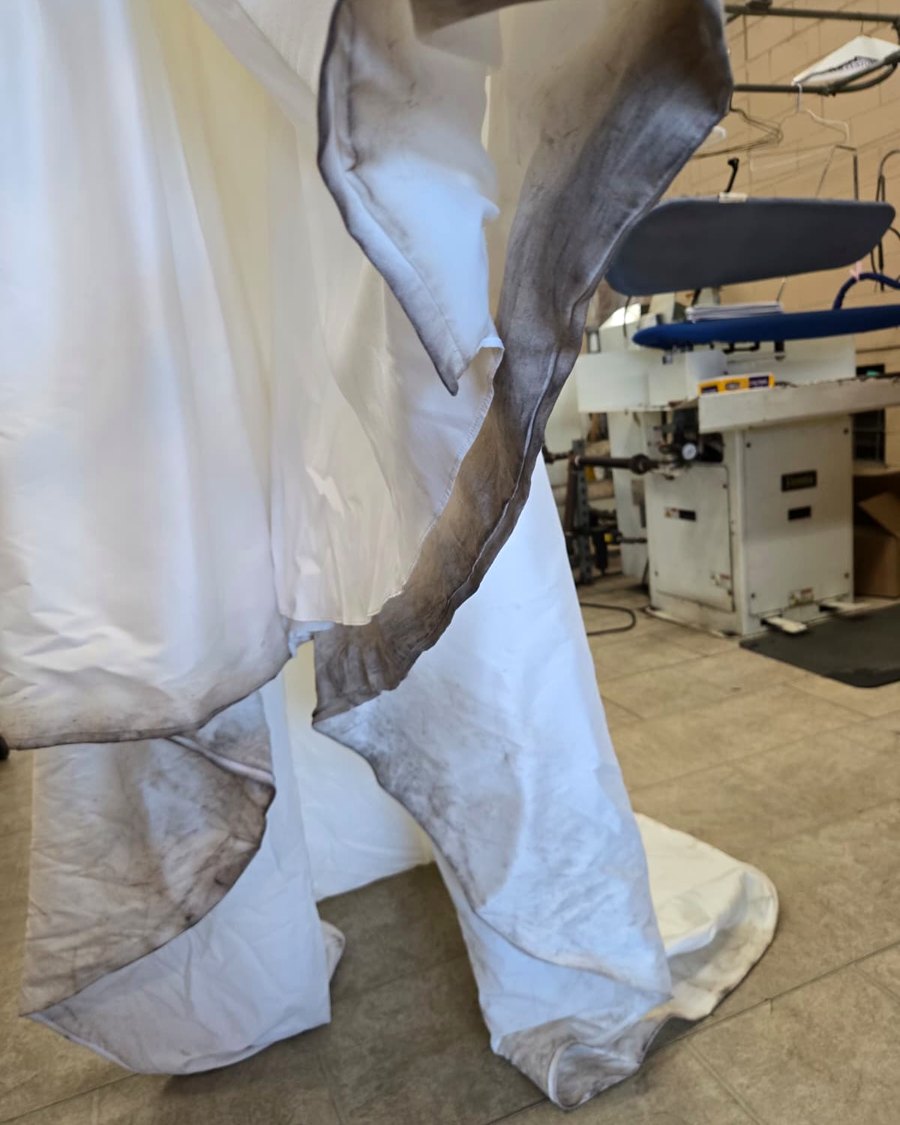 Wedding gown before cleaning, soiled train